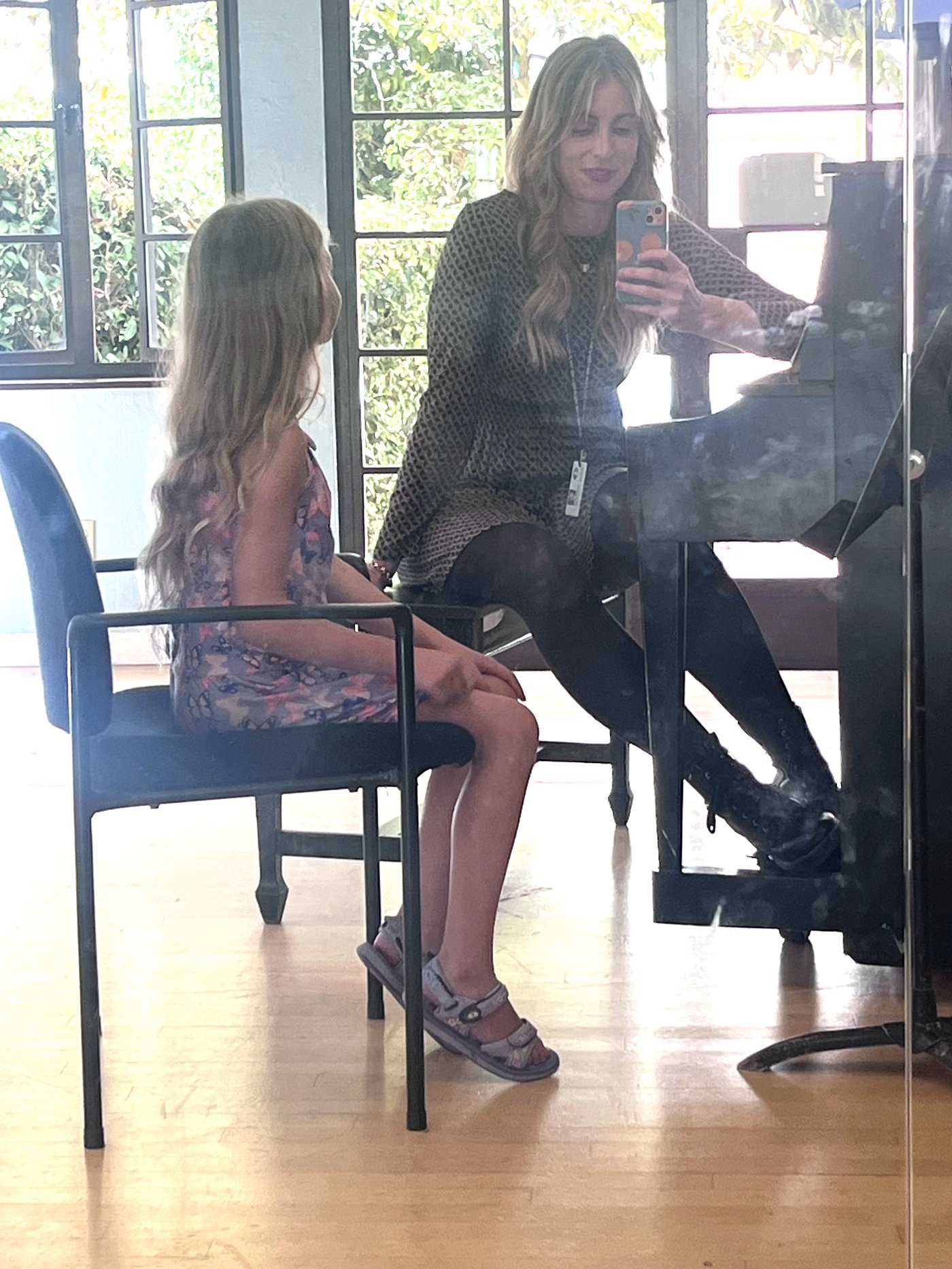Erin coaching a young student at the piano